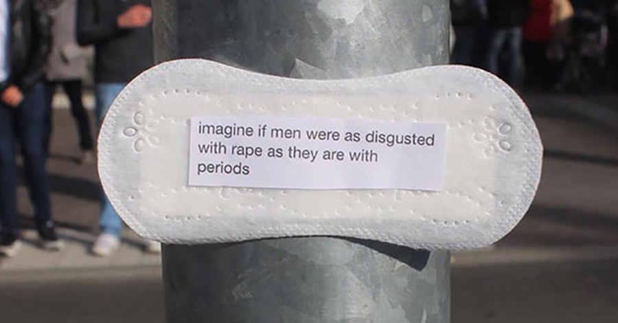 A Woman Is Sticking Powerful Feminist Messages Written On Period Pads