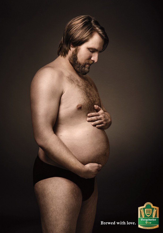 Beer Ad Shows Men Cradling Their Beer Bellies Like Pregnant Moms